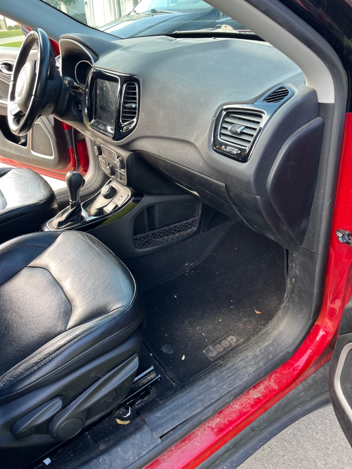 Jeep Compass dashboard and passenger footwell — before